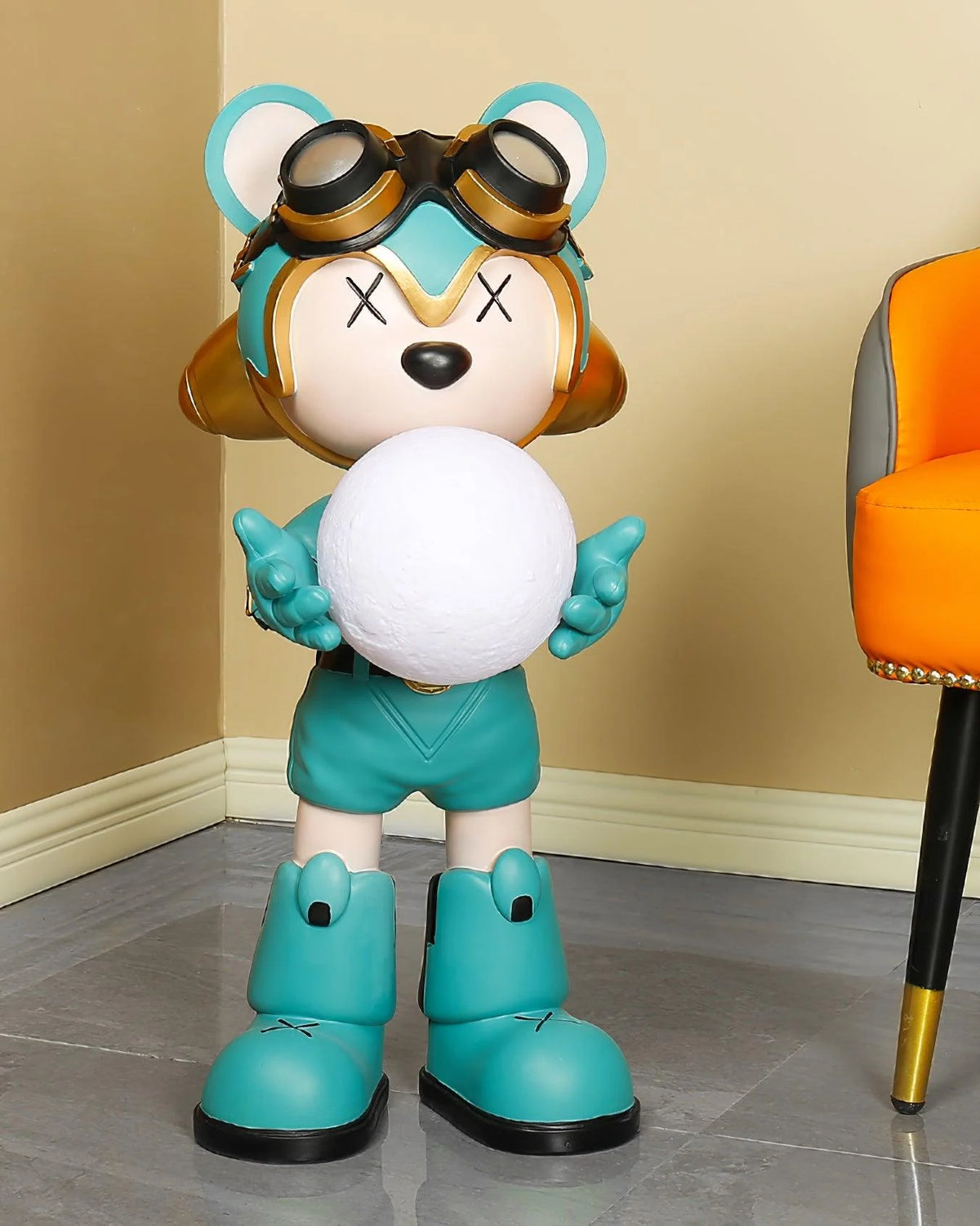 In the corner of this interior space, a blue-green bear floor lamp exudes unique charm.