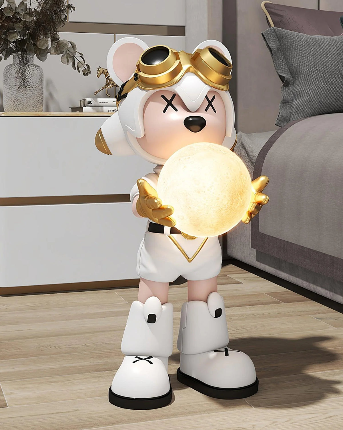 In the bedroom, the little bear floor lamp dressed in white with gold decorations is eye-catching.