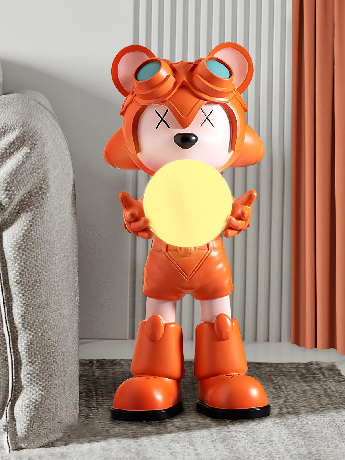 In a corner of the room, the orange bear-shaped floor lamp is very cute, creating a lively and warm atmosphere overall.