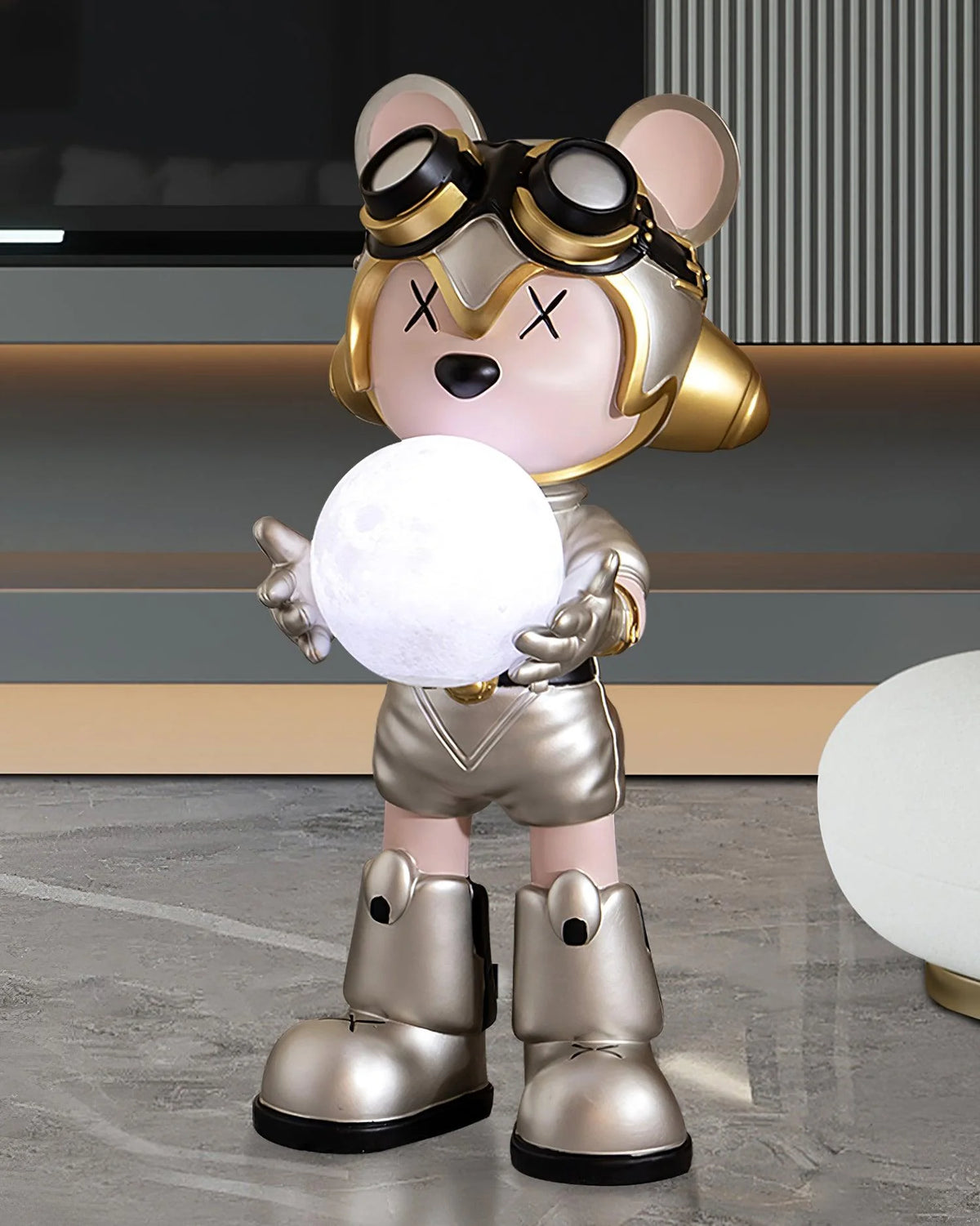 In the modern interior space, a silver-gold bear floor lamp becomes the visual focus.