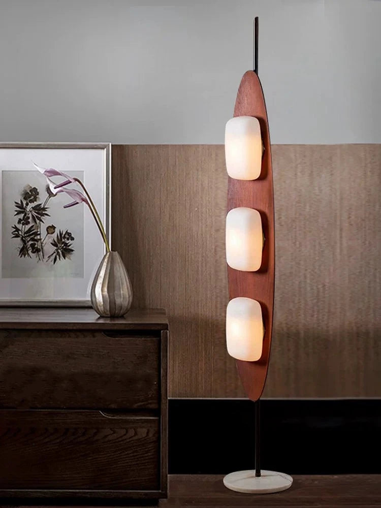 Modern surfboard floor lamp brightens corners with chic appeal.