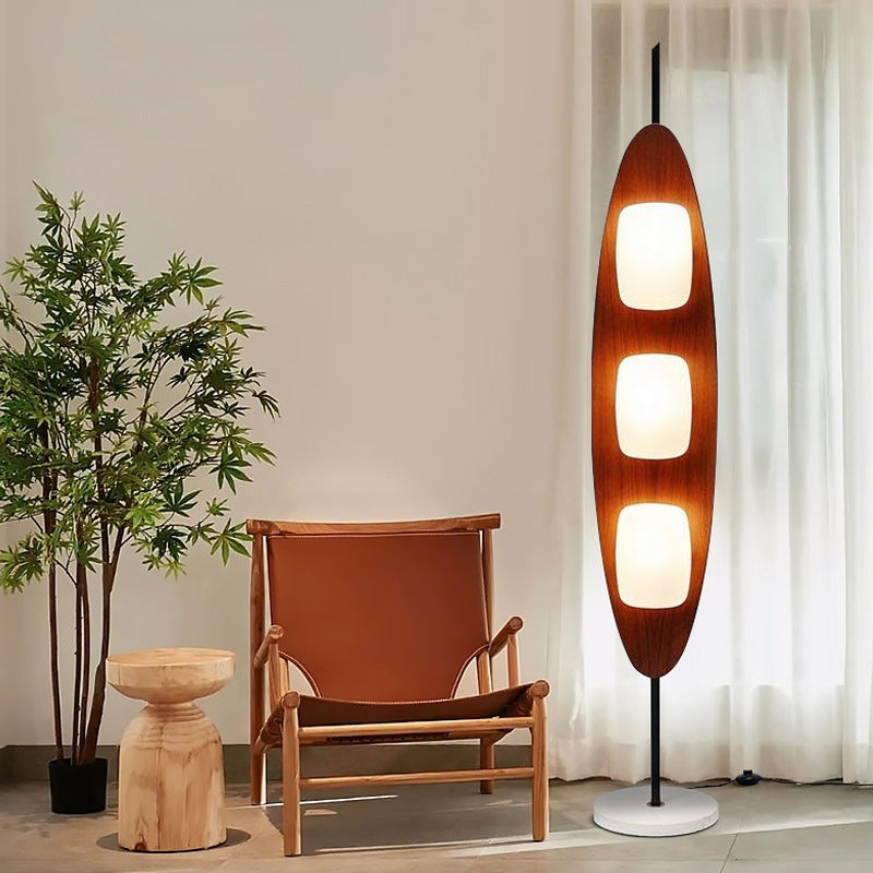 Elegant surfboard floor lamp blends form and functional lighting.