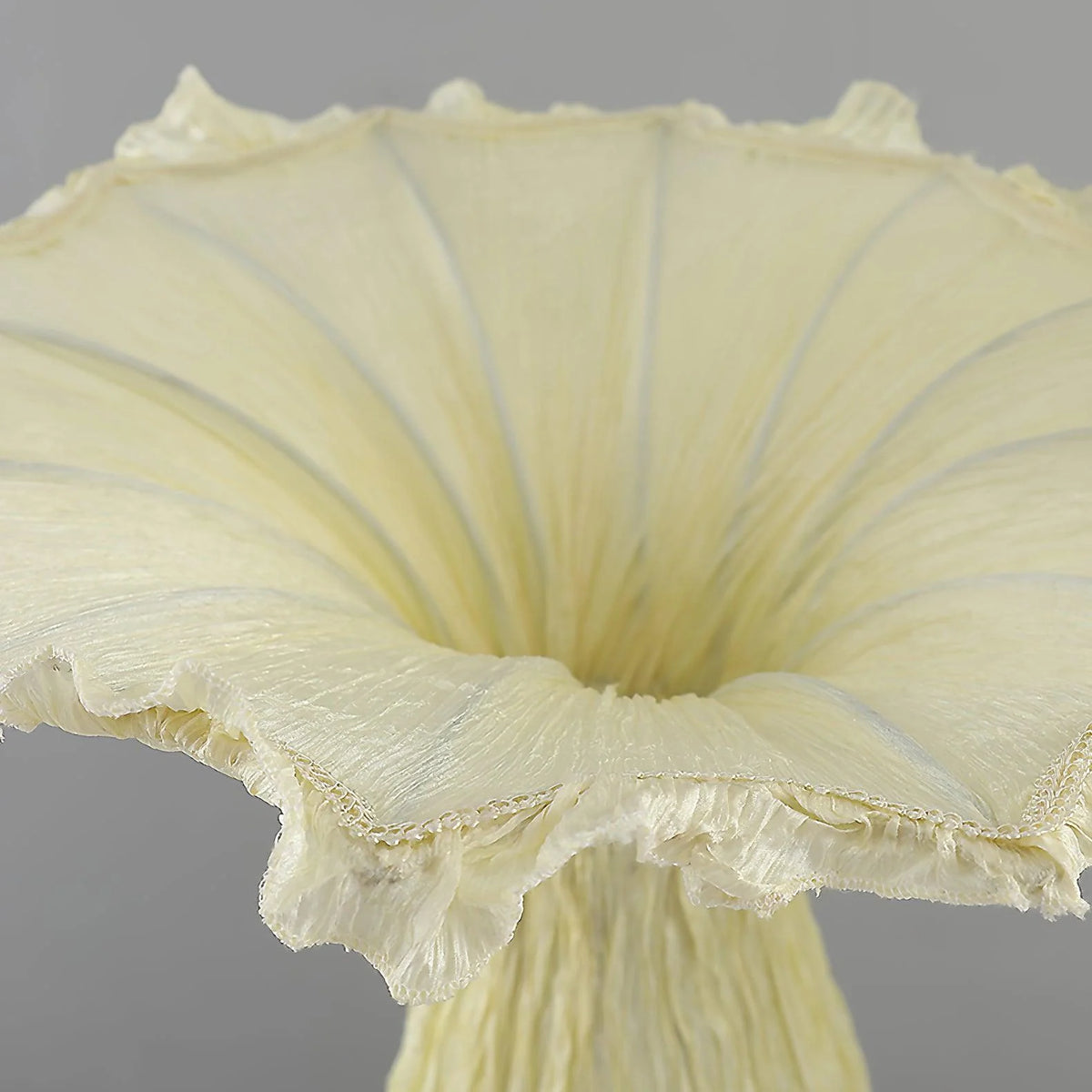 Details of the vase floor lamp, the fabric details are undulating like the hem of a skirt.