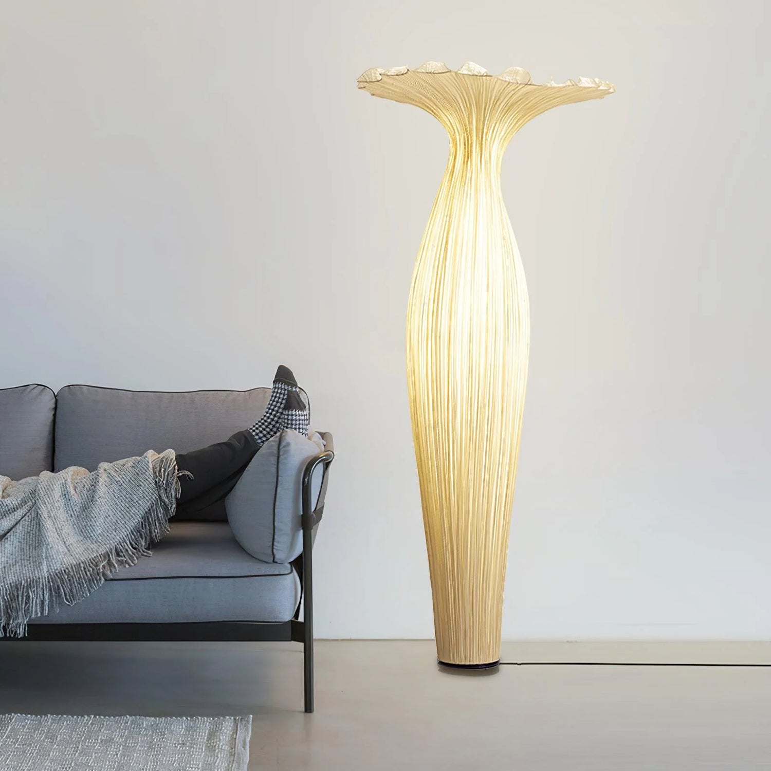 A simple style scene, with the Vase Floor Lamp placed next to the sofa