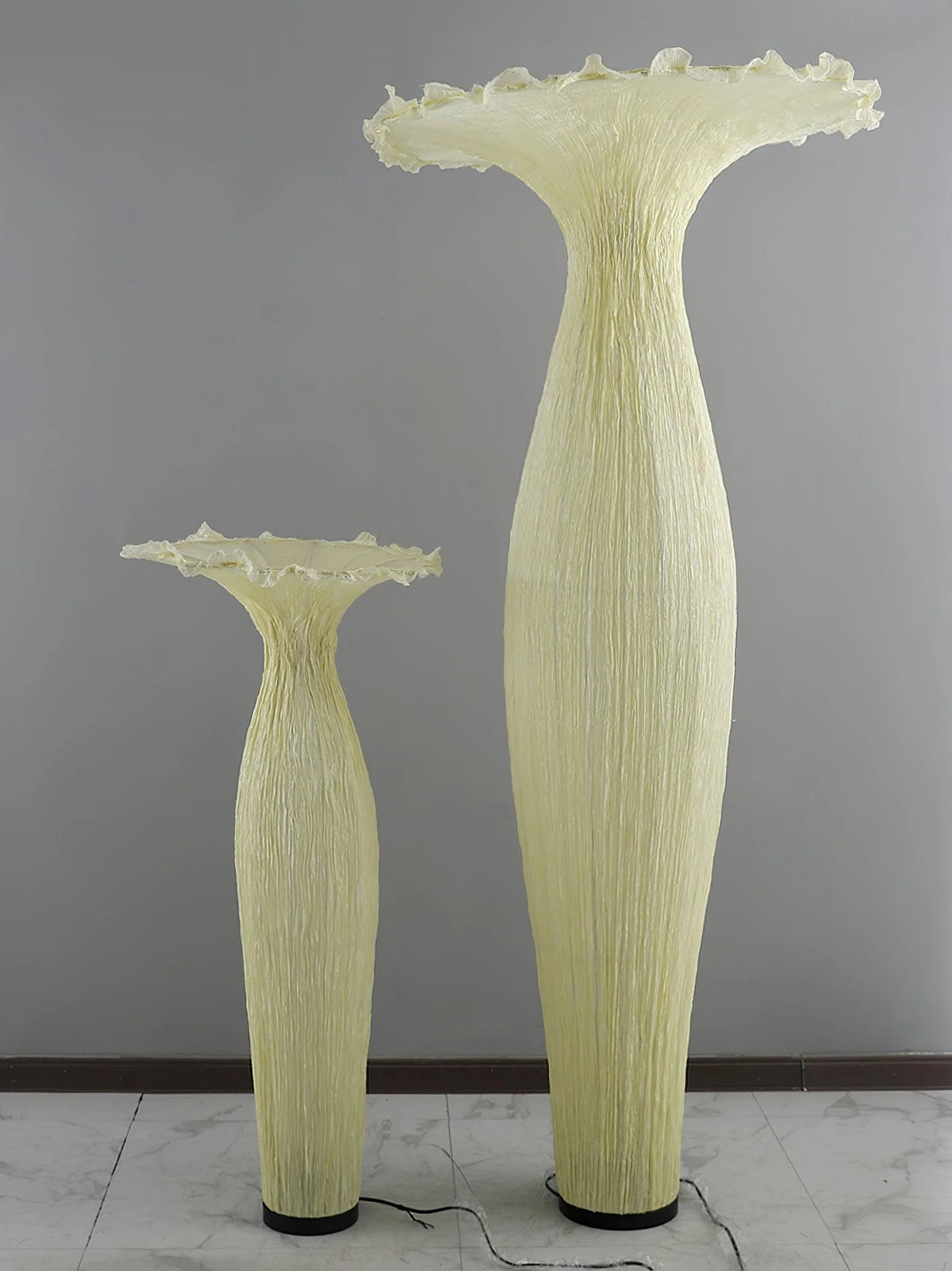 The small and large Vase Floor Lamp are placed side by side under the light off, which also creates another artistic feeling.