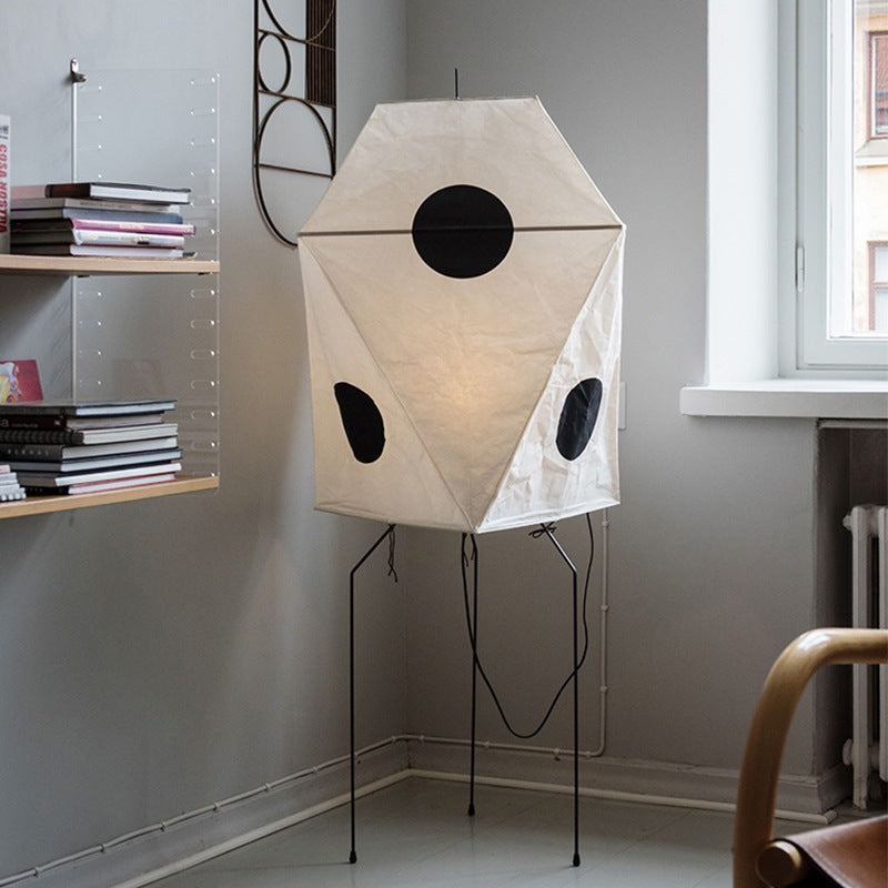 rice paper material, geometric silhouette, and black circles create serene light