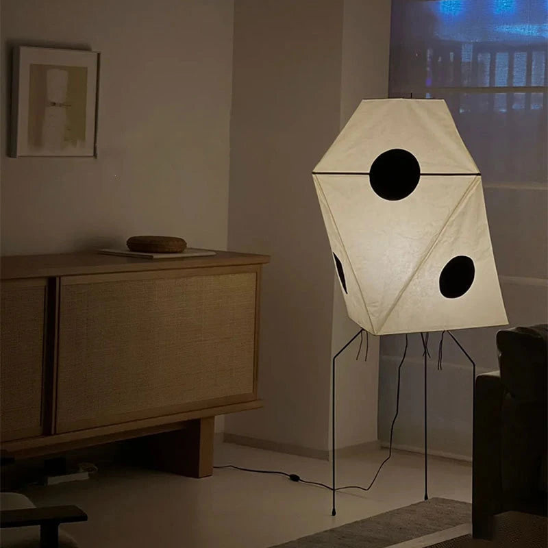 this floor lamp uses rice paper, combining a geometric design with black elements for warm, soothing light.