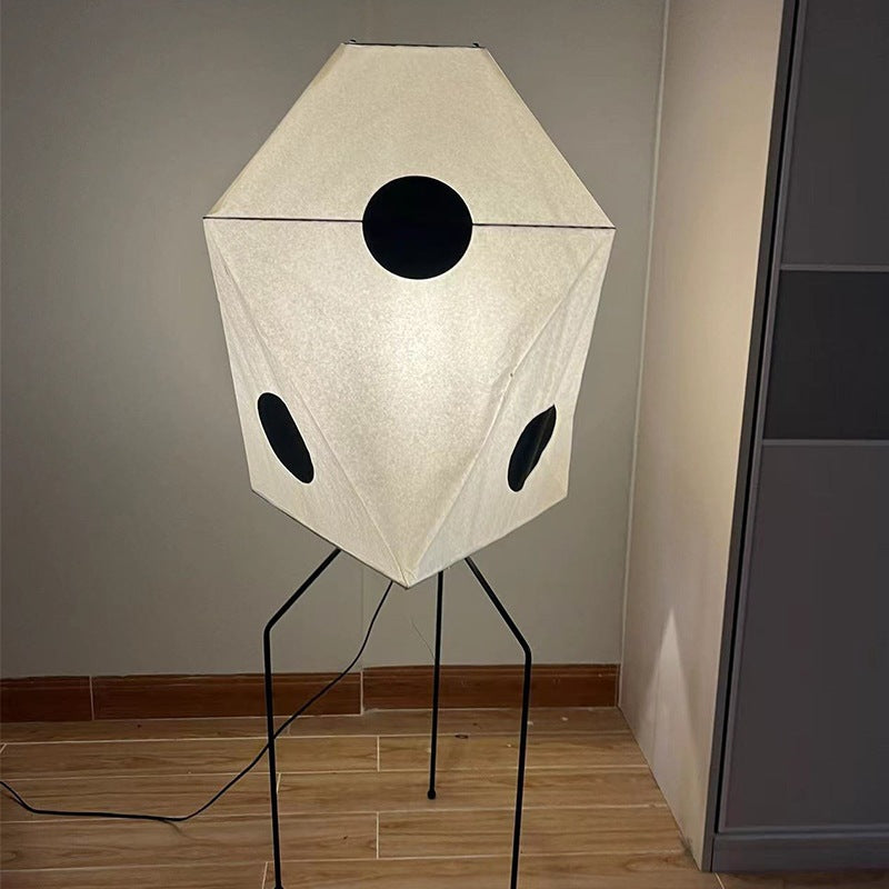 This Japanese floor lamp, made of rice paper brings a warm light at night