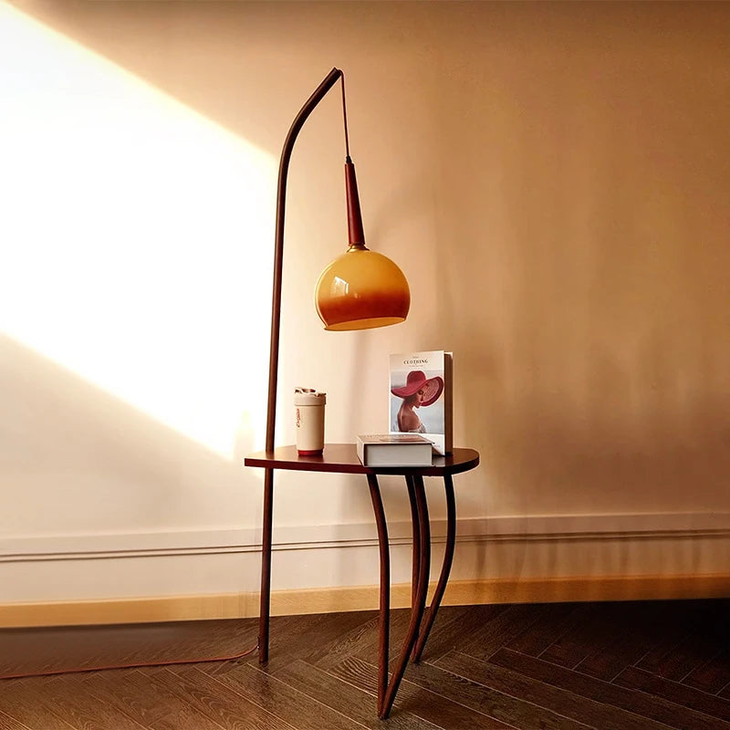 Functional floor lamp featuring grapefruit design glass shade and handy shelf