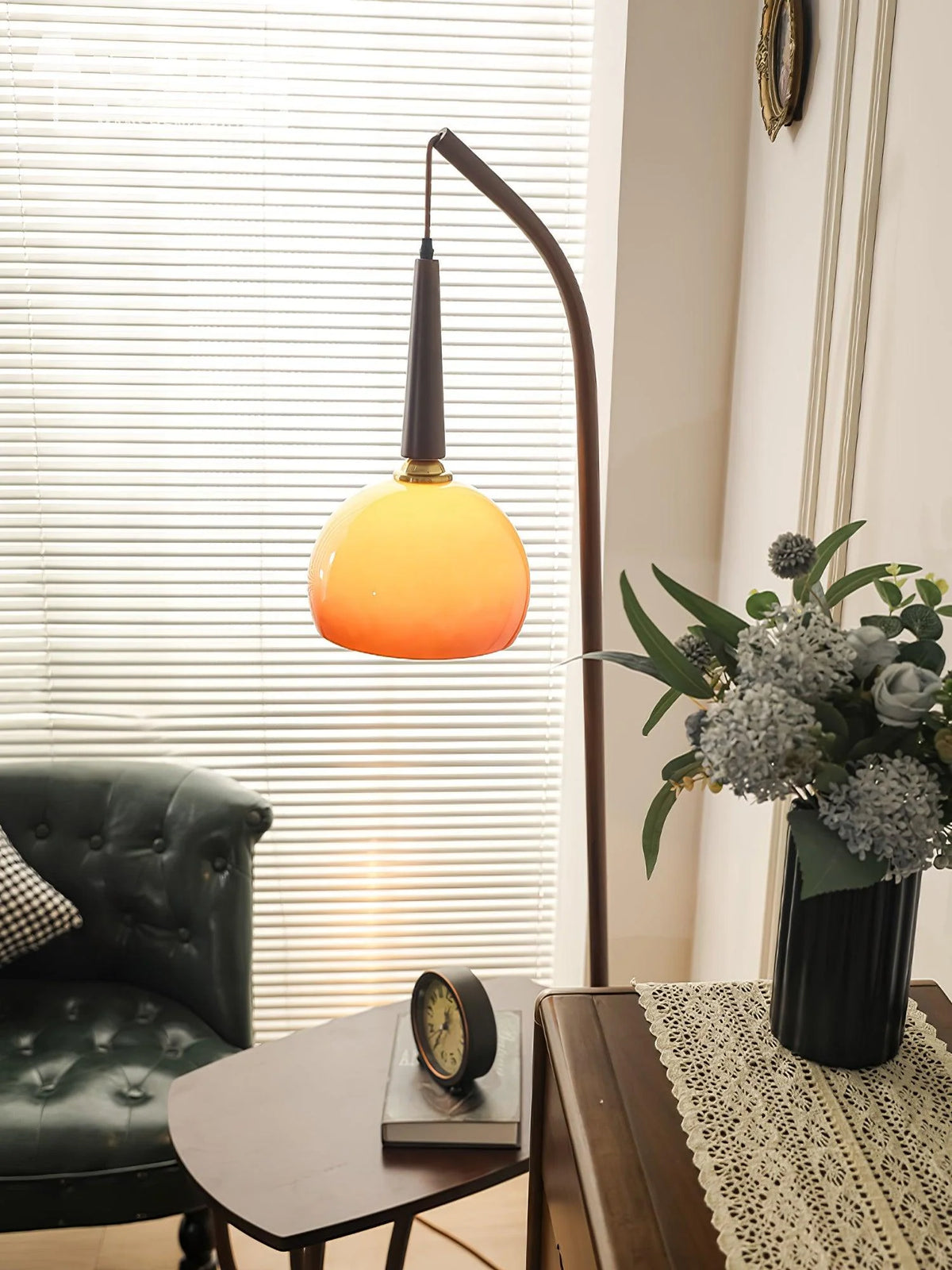 Perfect for bedroom corners: floor lamp with grapefruit-shaped glass part and functional shelf
