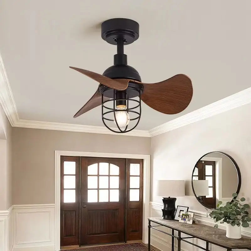 Black industrial ceiling fan light with wood blades and cage shade, installed in a home entryway
