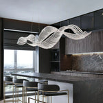 Wavy crystal chandelier on the kitchen island on the high floor