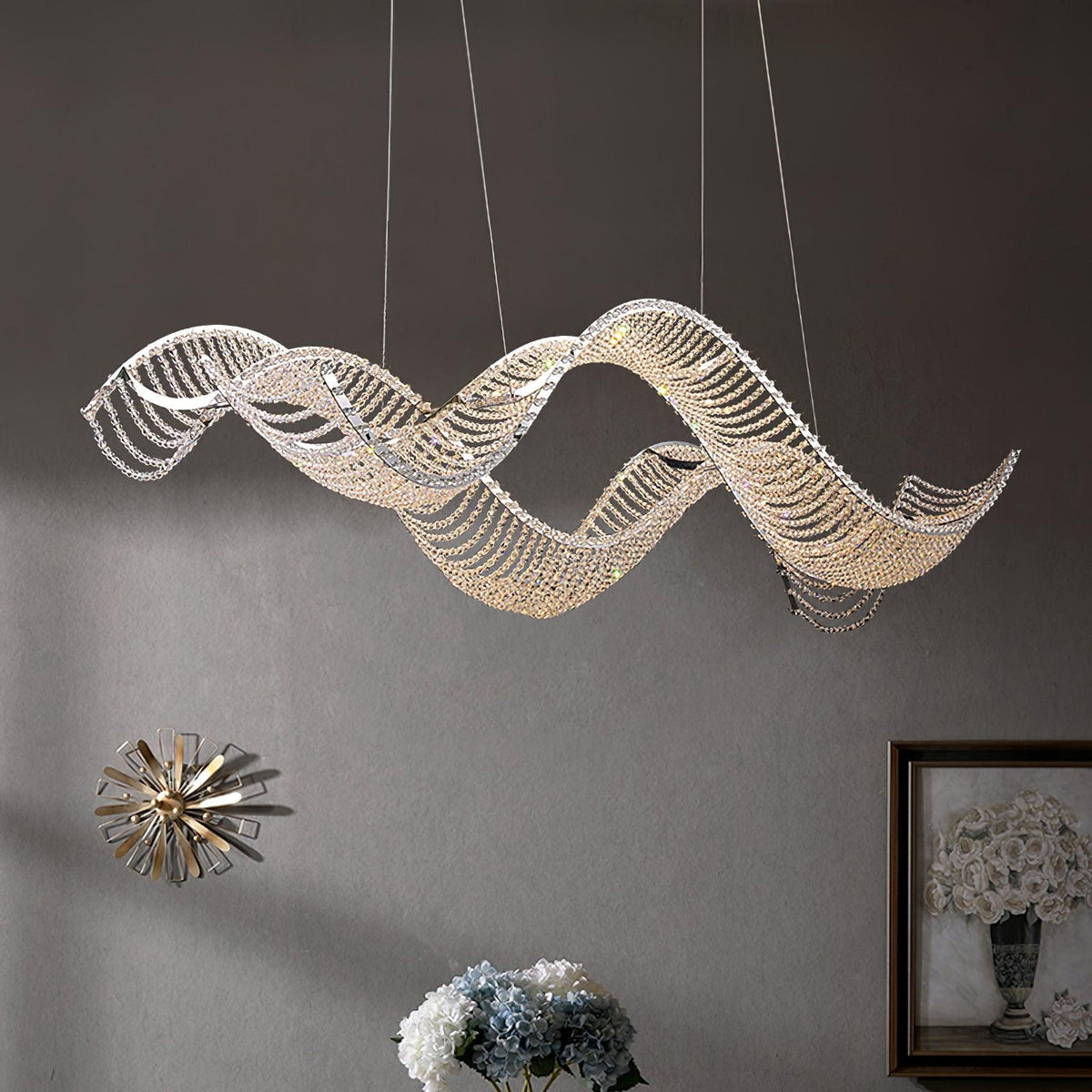 The chandelier covered with crystal beads emits a warm warm light in the evening