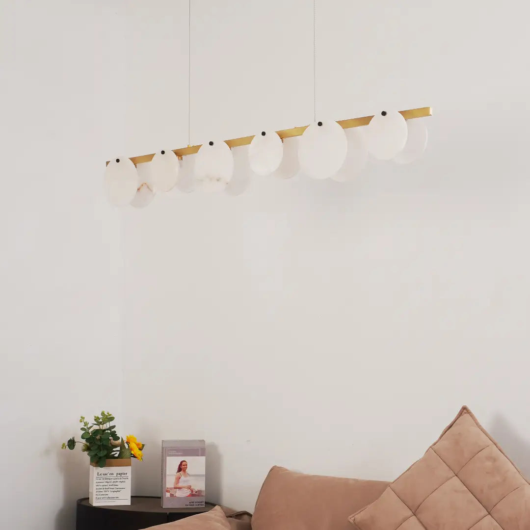 Unlit alabaster restaurant chandelier serves as elegant art ornament inside modern living room