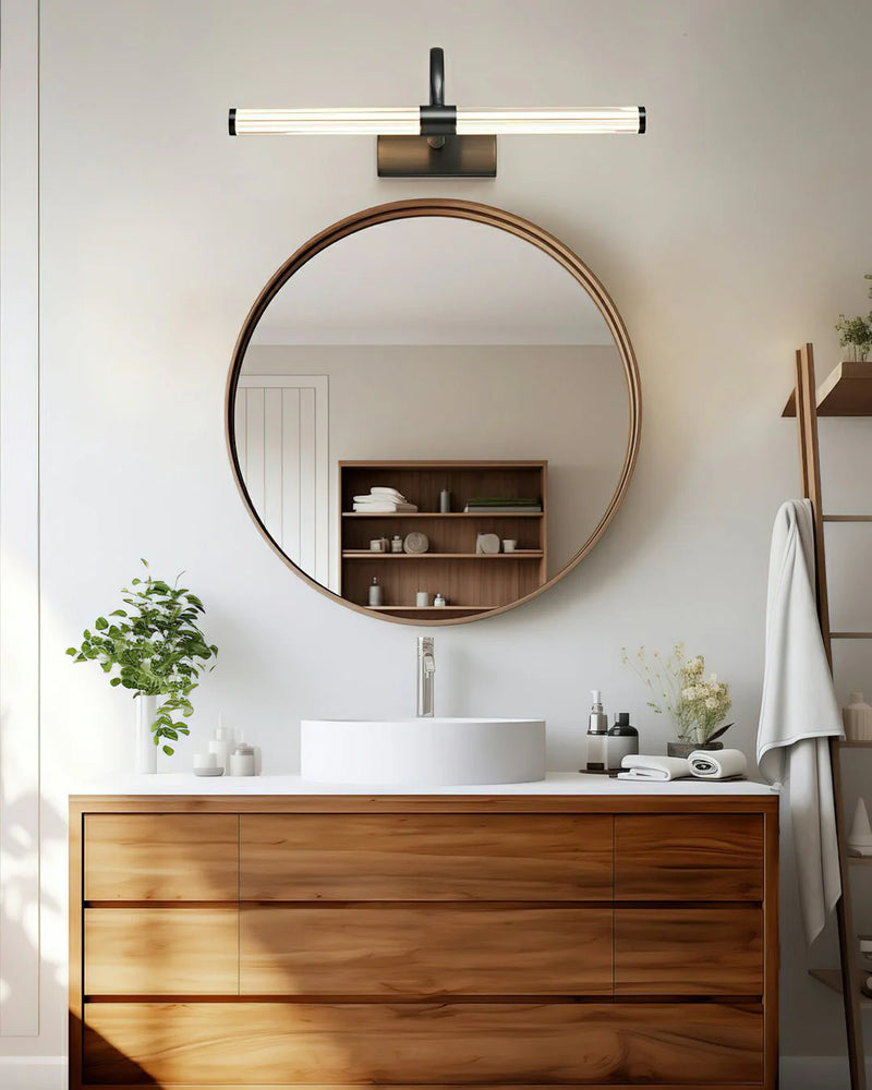 fresh bathroom interior style blends naturally with the sleek design of avery wall light