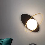 Galaxy - themed wall lamp with a white glass globe encircled by a golden ring.