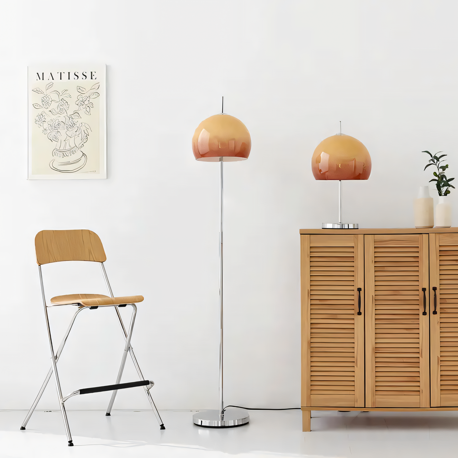 orange mushroom floor lamp and table lamp set in minimalist living room with wood cabinet and matisse wall art
