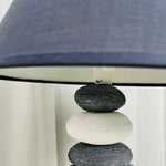 Sleek ceramic stone desk lamp for contemporary offices or cozy reading nooks.