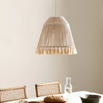 Bohemian tassel pendant lamp hanging over the dining table