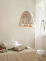 The pendant light named after the tassels decorates the bedside