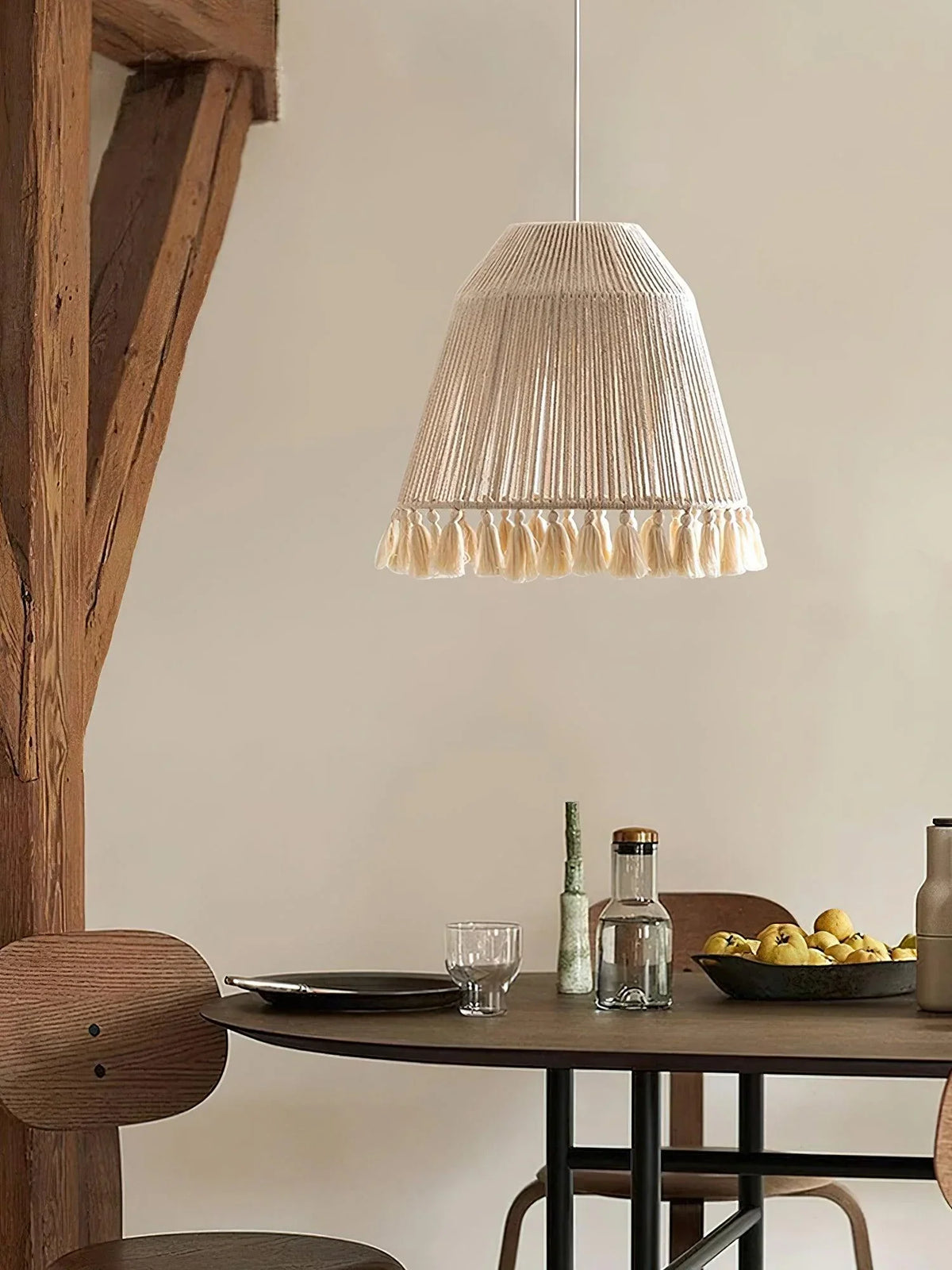 Above the wine bottles and food, there is a tassel chandelier with adjustable color temperature.