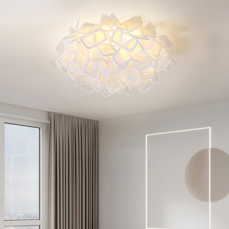 Close-up of the Clizia light, emphasizing its lightweight material and light-diffusing properties.