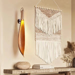 Cocoa Leaf Wall Lamp mounted on beige textured wall with warm ambient lighting