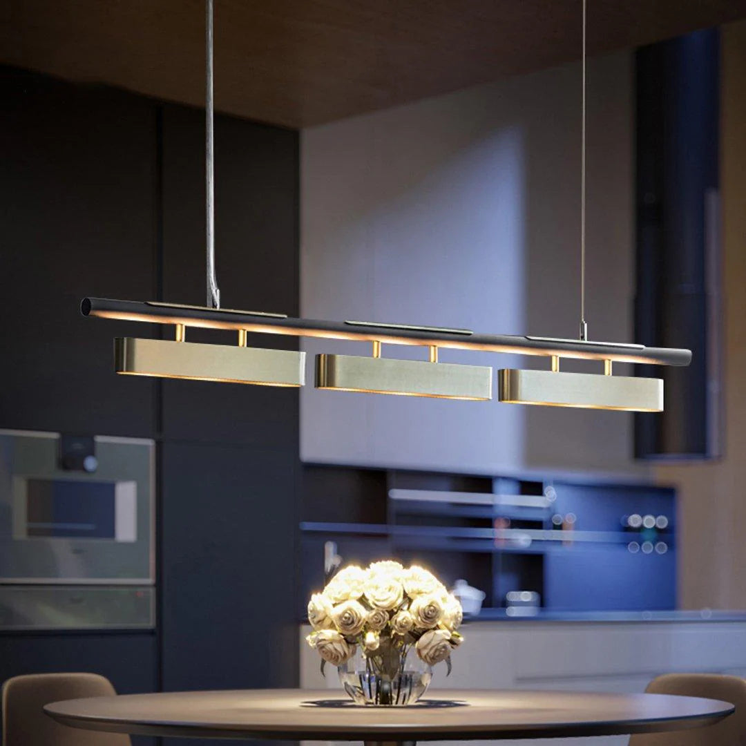 Modern minimalist Colt chandelier hangs above the dining table