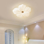 Cream Flower Ceiling Lamp casts a warm glow in the bedroom