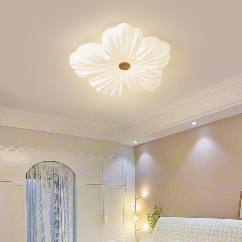 Cream Flower Ceiling Lamp casts a warm glow in the bedroom