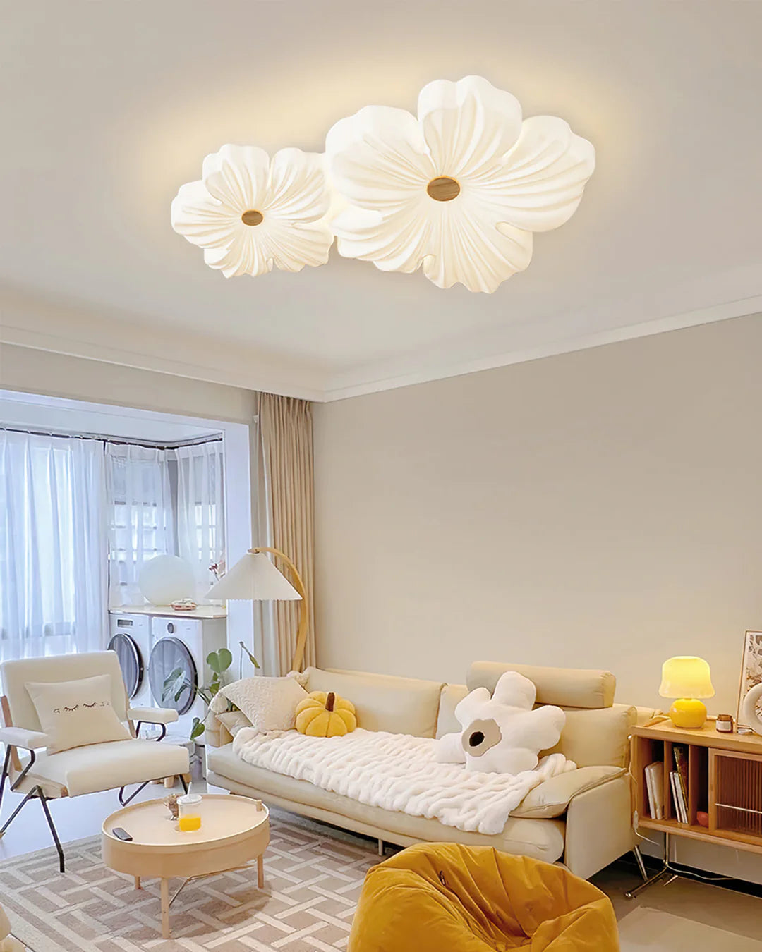 Warm glow from cream flower lamp illuminating a Scandinavian-style living room