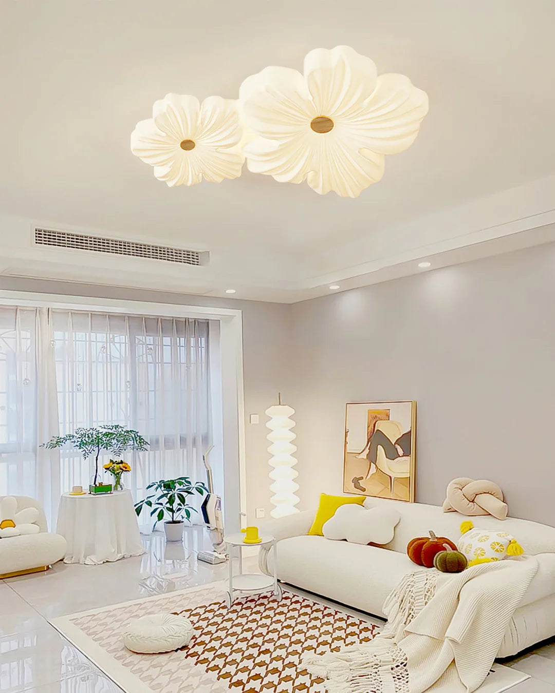 Cream flower ceiling lamp casting soft light in a modern living room setting