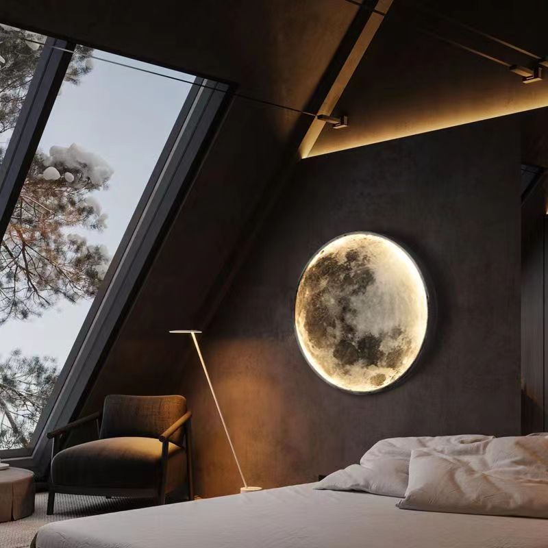 The lunar wall lamp emits a charming light in the attic bedroom