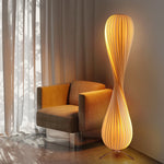 Creative_spiral_floor_lamp_with_striped_details_adding_cozy_ambiance_to_spaces.