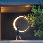 Energy - efficient Crescent Wall Light creating a warm lighting effect on wall