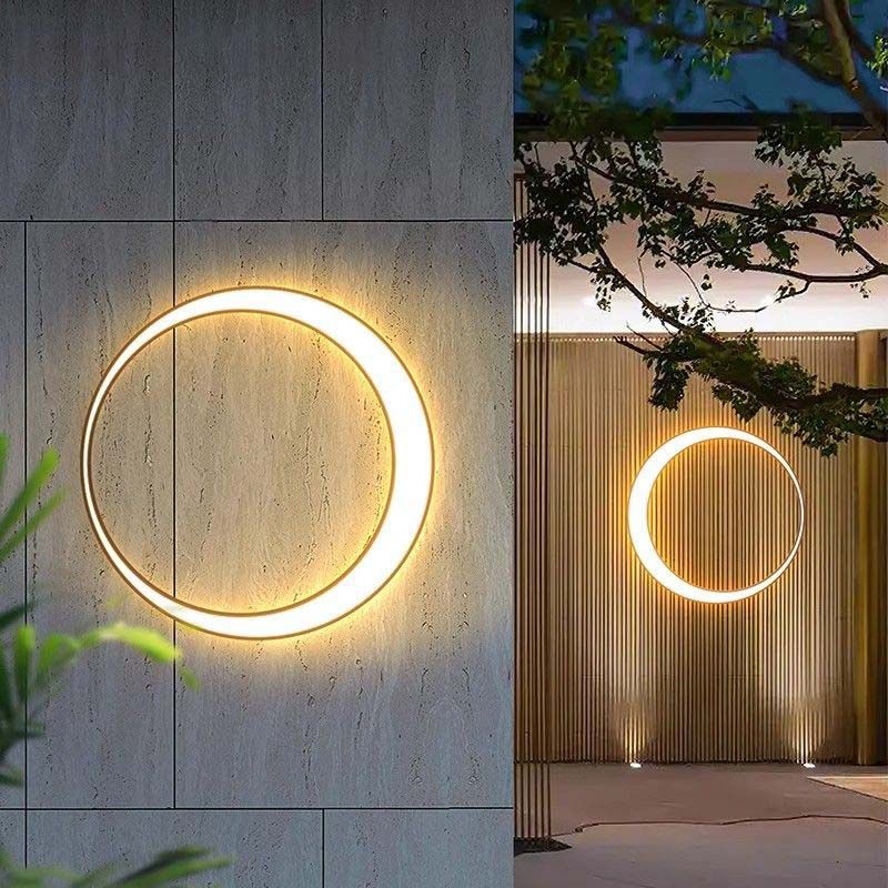 Unique Crescent Wall Light featuring a luminous circular element on wall