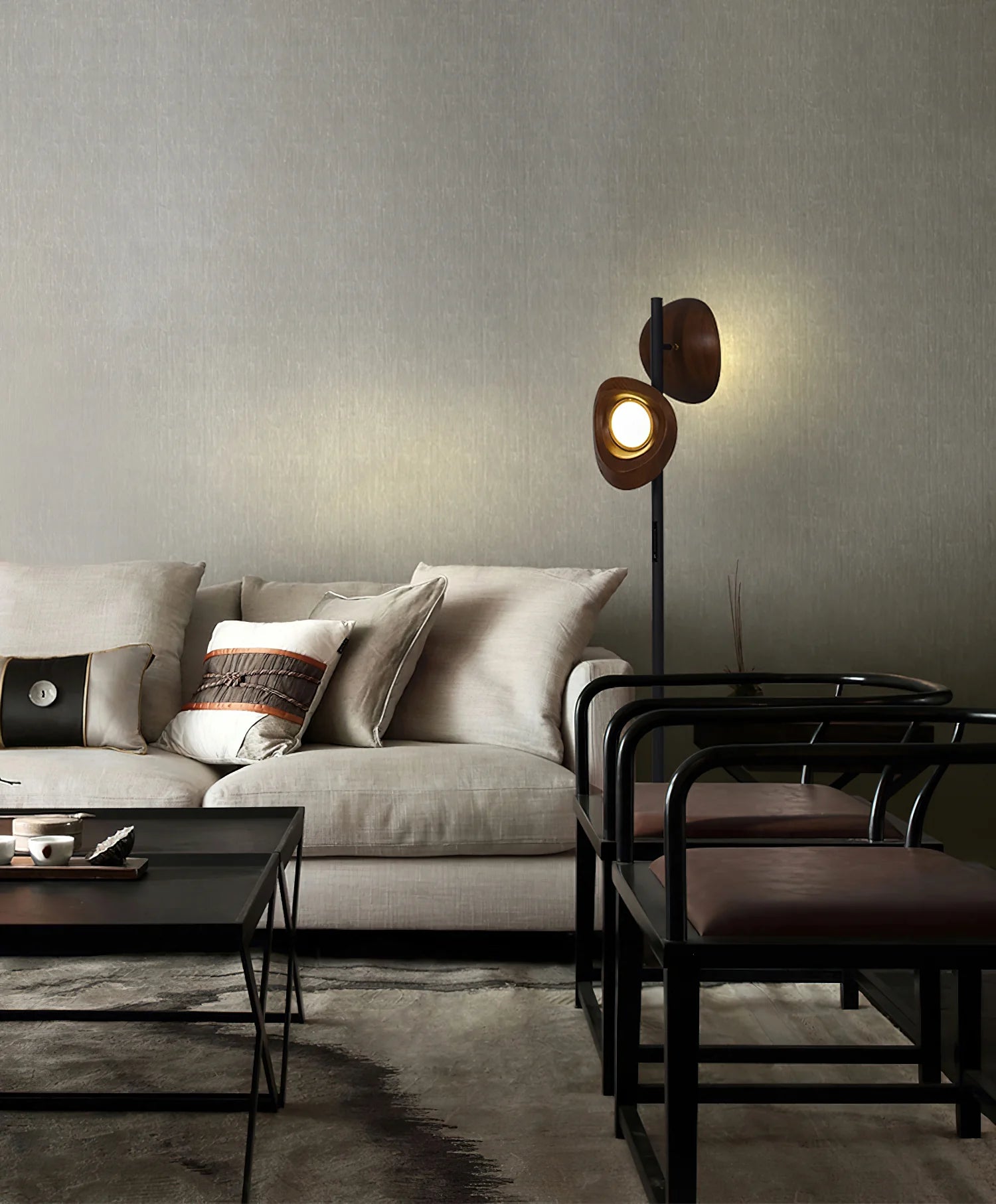 The black floor lamp emits a cozy warm light in the living room