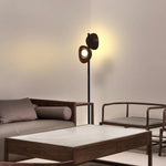 Black Double Headed Floor Lamp Illuminating a retro living room