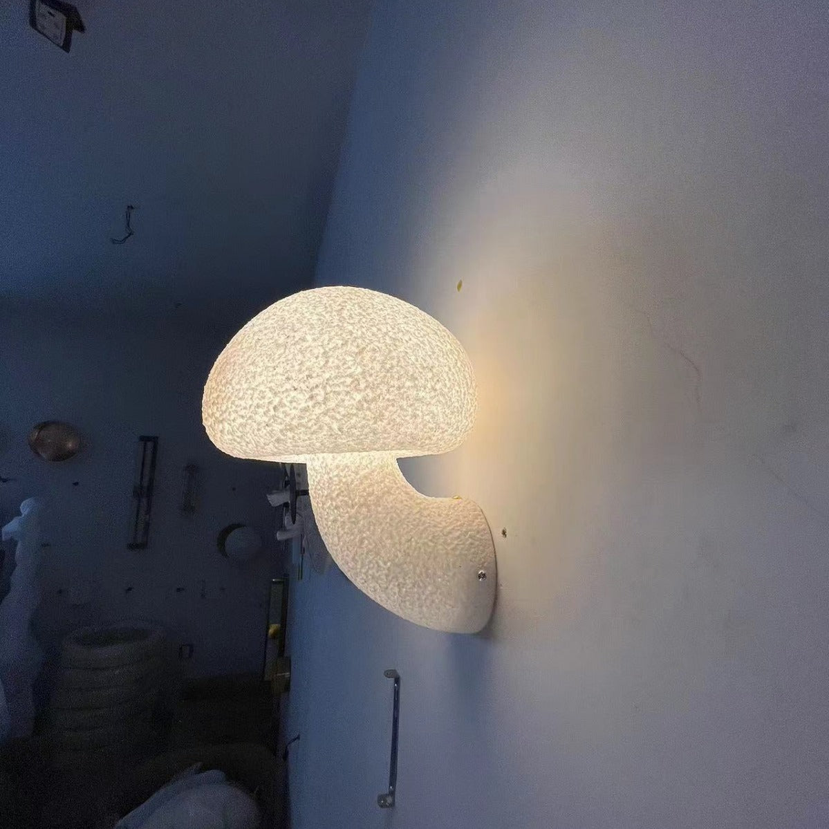 From another perspective of the factory, the glowing Mushroom Sconce