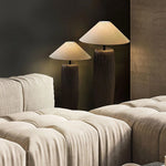 Floor lamp next to the sofa in a Wabi Sabi style space