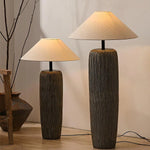 Floor lamps add a warm feeling to the living room.