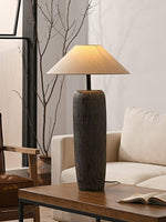 Wabi Sabi Lamp made of ceramic is placed on the wooden table