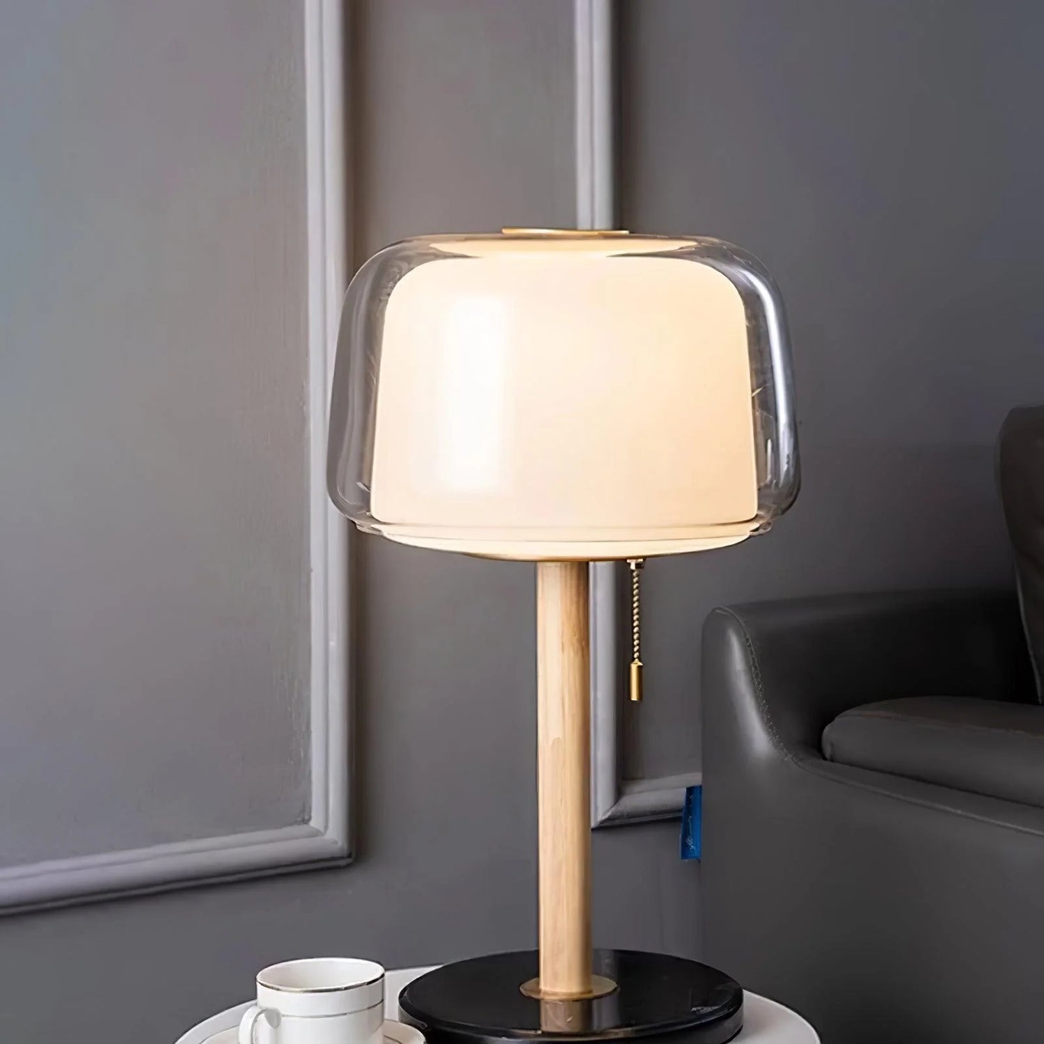 Evedal_Table_Lamp_made of marble base with glass glowing beside the sofa