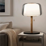 Evedal glass table lamp next to the sofa on a summer night