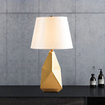 Metal polyhedron table lamp on desk