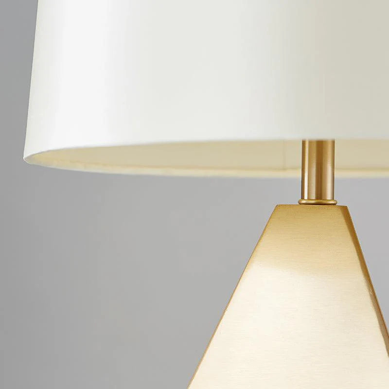 Details of the fabric shade and body of the faceted table lamp