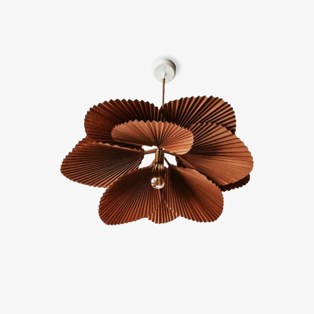 Unique pendant light showcases 10 folded paper leaves, creating an artistic floral display.