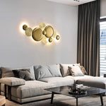 Multi-spherical wall lamp next to the hotel sofa