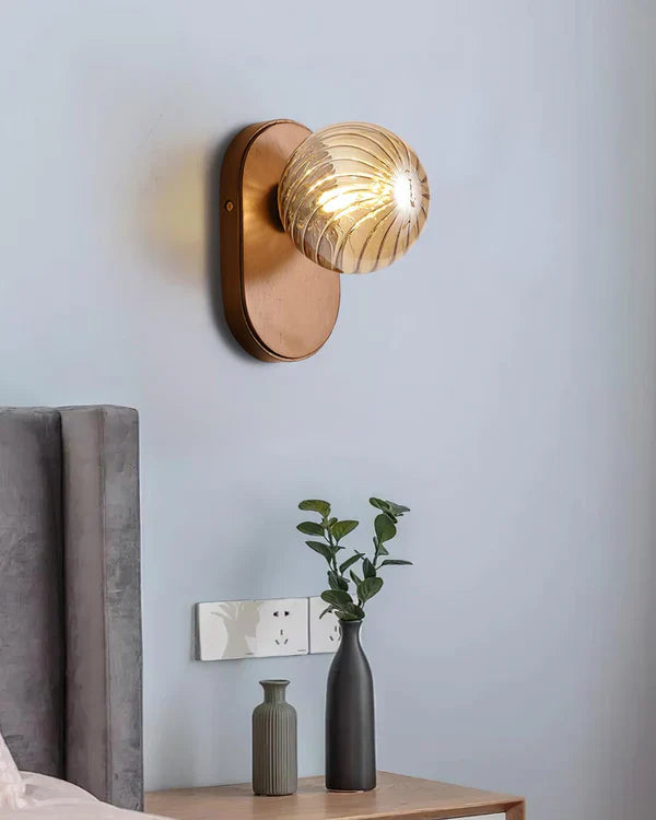 Home decor wall lamp: wooden base supports an intricately designed glass ball, adding artistic charm to walls.