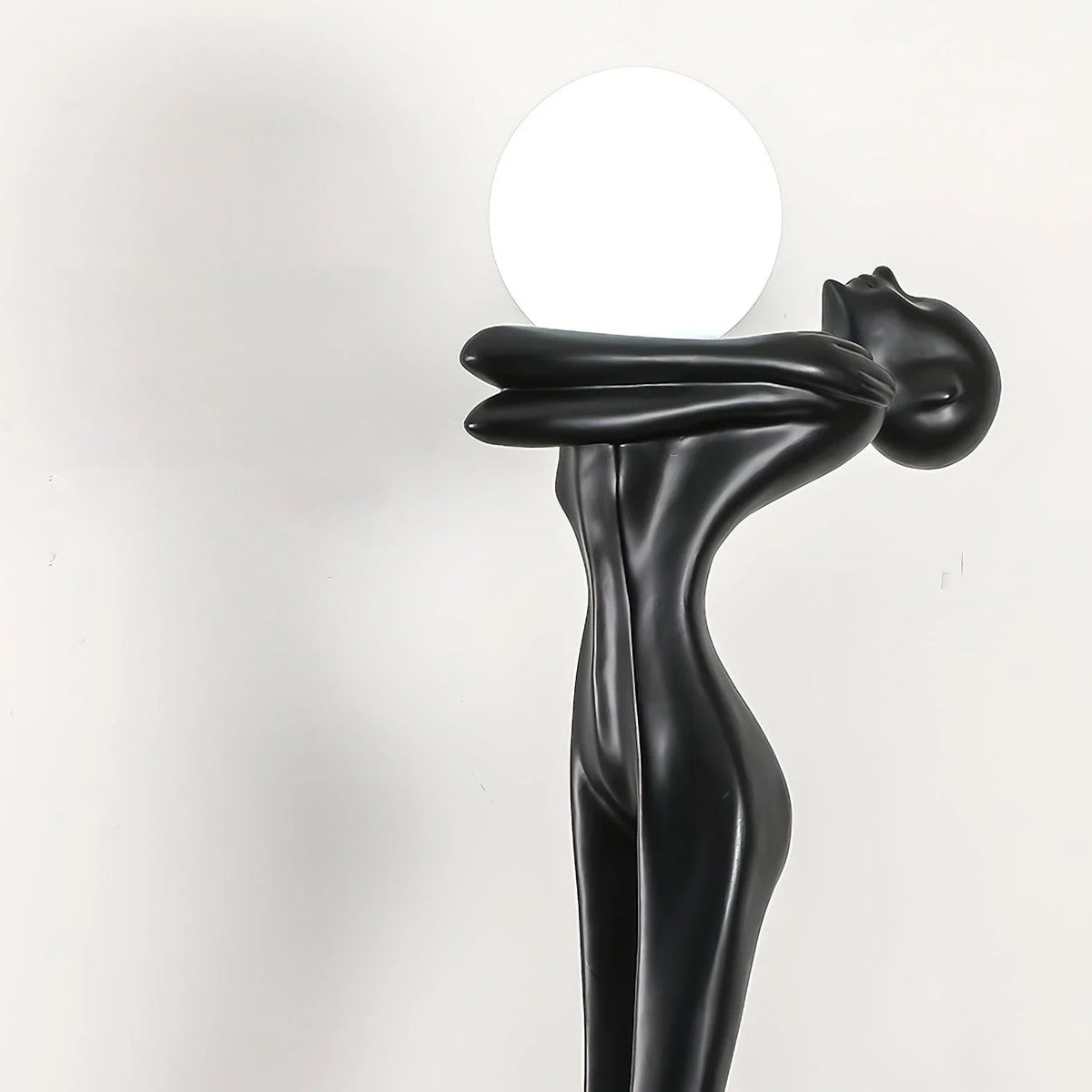 Artistic humanoid floor lamp with spherical illumination